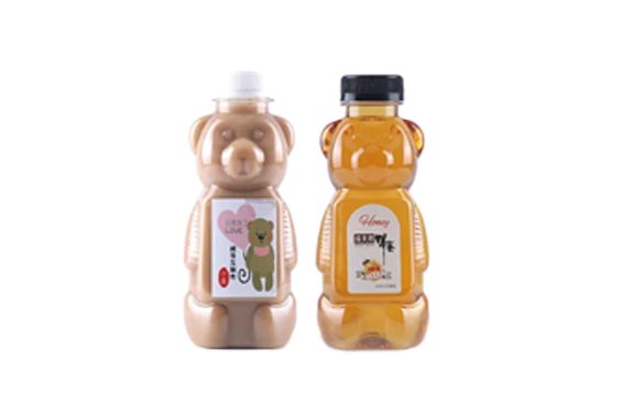 Wholesale custom size clear 250ml PET plastic bear juice bottles with caps