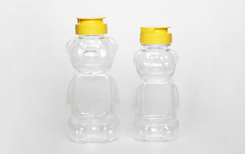 Custom 8oz Cartoon PET Refillable Plastic bear Honey Bottles with Lids
