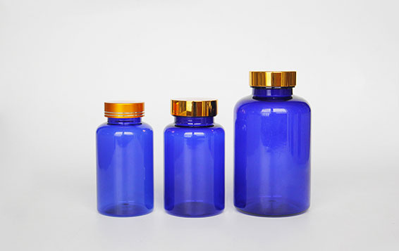 Gold lid blue prescription medicine plastic storage bottles